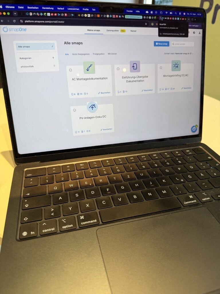 Laptop zeigt Dokumenten-Management-Software auf Sonnwärts-Website.